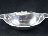 a close up of a glass bowl on a black surface