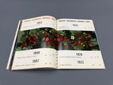 an open book with a picture of a bunch of strawberries on it