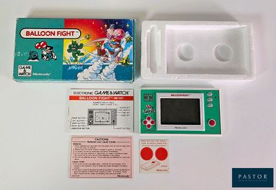 une image d'une Nintendo Game Boy avec sa boîte et son mode d'emploi