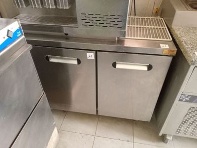 a stainless steel kitchen with a sink and a dishwasher