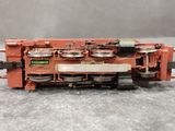 a toy train on a table with a gray background