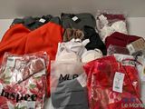 many different types of clothing on the table together