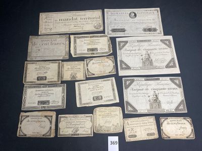 some old paper money sitting on top of a table next to a sign
