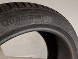 a close up of a tire on a white surface