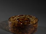 a glass bowl that is sitting on a table