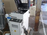 a machine that is sitting on a pallet in a garage