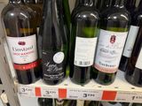 many bottles of wine on the shelves in the store