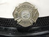 a close up of a hat with a badge on it