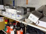 many boxes and cans on a shelf in a room