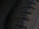a close up of a tire on a black surface