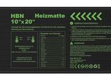 un chargeur de batterie noir et vert sur lequel figurent les instructions