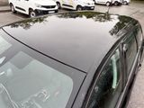 many cars parked in a parking lot near each other