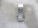 a close up of a watch on a white cloth
