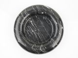 black marble plate on white background with copy space for text