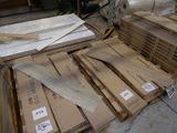 a lot of boxes of wood sitting on the floor