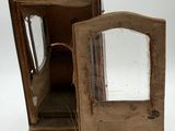 a small wooden cabinet with a mirror in it