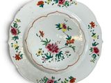 a white plate with a floral design on it