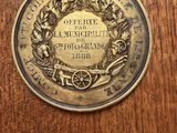 an image of a commemorative coin on a wooden table