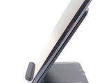 a cell phone that is sitting on top of a stand