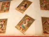 an open book with pictures of children on it on a table