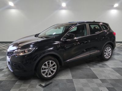 a black suv parked in a room with a checkered floor