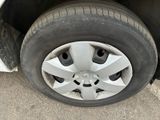 a close up of a tire on a car ' s rim