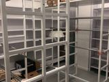 a room with a lot of shelvings in it