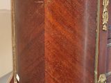 a close up of a wooden table with a drawer on top of it