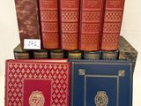 several books are stacked on top of each other on a table