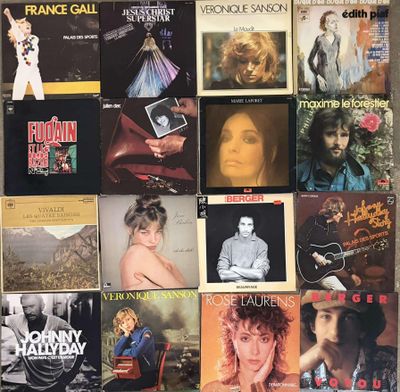 many different album covers on the wall of this room