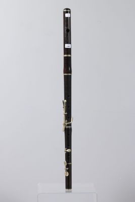 a close up of a black and gold pen on a clear stand