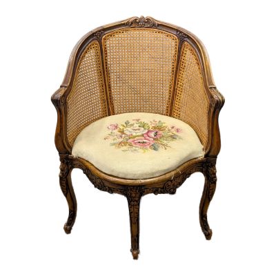 an image of a chair with a floral cushion on it