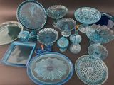 many glass dishes and trays that are on the table