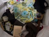 a bag full of clothes and other items in it