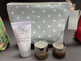 a cosmetic bag with a lot of items on the table