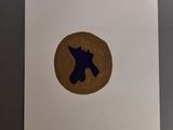 a close up of a piece of paper with a dog on it