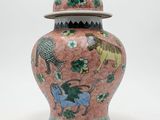 an image of a pink vase with animals on it on a white background