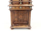 a wooden cabinet with a mirror on top of it