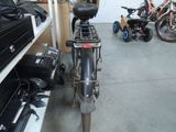 a bike that is parked in a garage next to other bikes