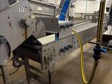 an image of a factory with a conveyor belt and a conveyor belt
