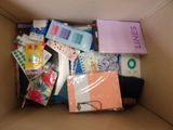a cardboard box filled with assorted items in it