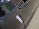 a black car with a sticker on the side of it
