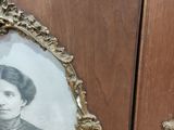 a picture of a woman that is in a picture frame