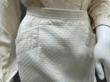 an image of a mannequin wearing a white skirt