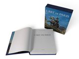 an open book with a picture of a statue on it