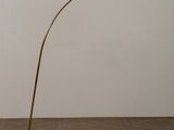 a brass floor lamp with a marble base and a white marble base