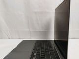 a laptop that is sitting on a white surface