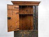 a wooden cabinet with a door open on a white background