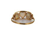 a close up of a gold ring with hearts on it