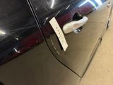 a sticker on the door handle of a car